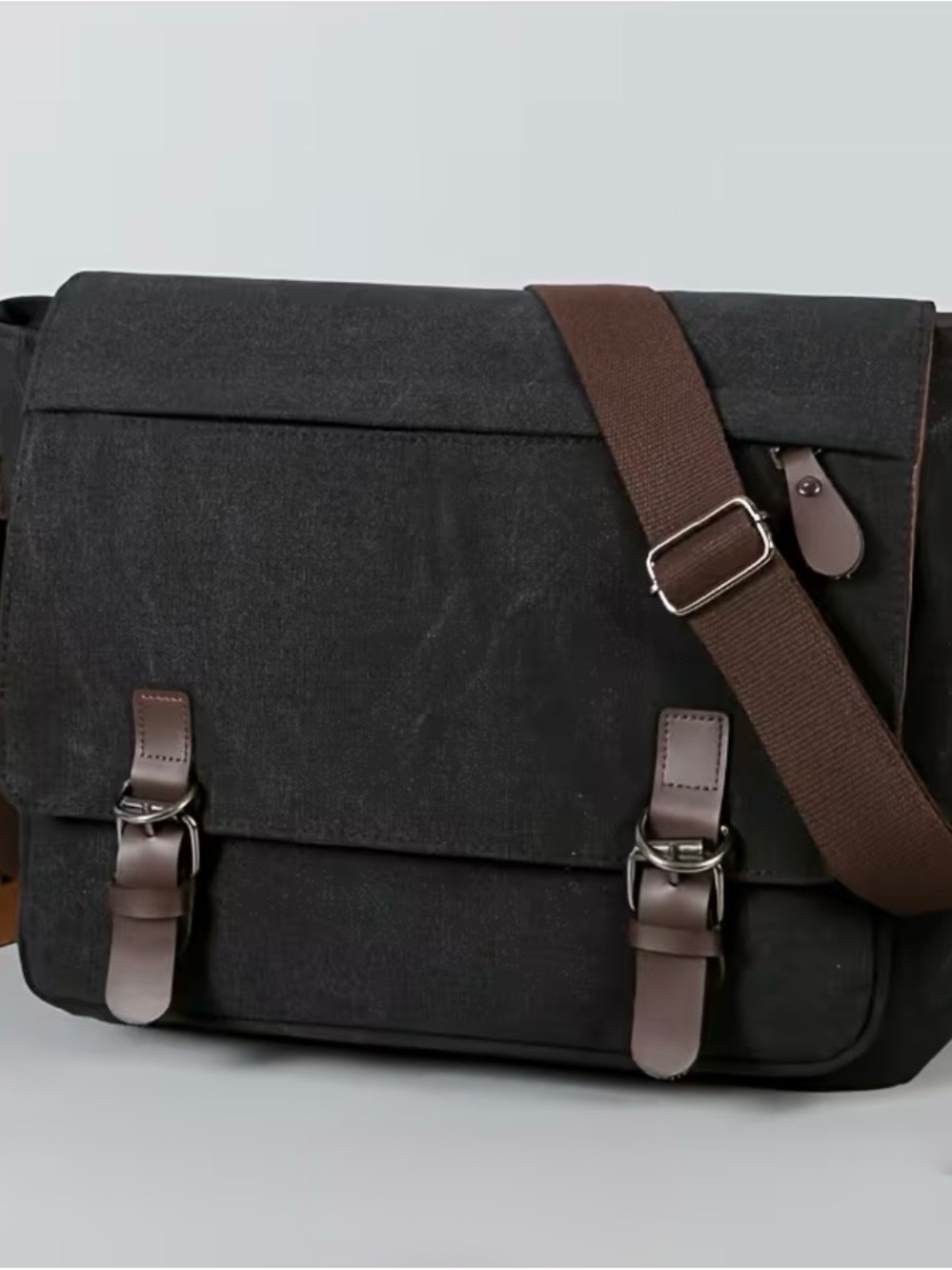 Black Canvas Messenger Bag with Brown Trim and Adjustable Strap